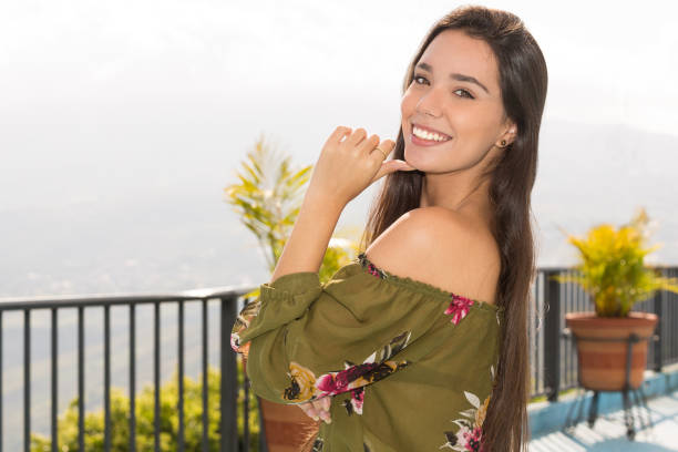 istock Young Lady Portrait Outdoors Smiling and Hand on Chin 918953626