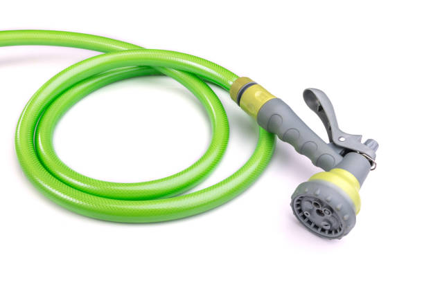 istock Water hose and spray gun isolated on white background 918959406