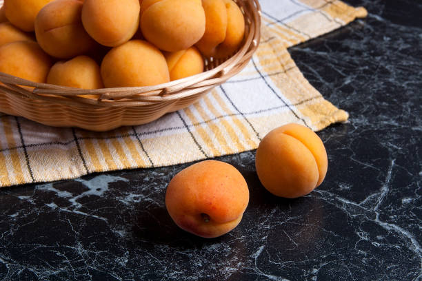 istock Group of harvested apricots in basket. 918962894