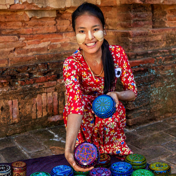 istock Young Burmese girl selling a lacquerware in Bagan, Myanmar 918965180