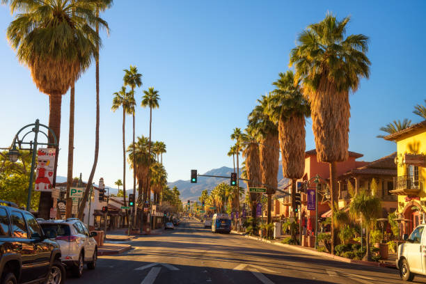 Scenic street view of Palm Springs at sunrise Palm Springs, California, USA - December 27, 2017 : Scenic street view of Palm Springs at sunrise. It is a desert resort city in Riverside County within the Coachella Valley. riverbank stock pictures, royalty-free photos & images