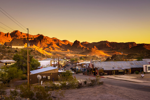 Oatman, Arizona, USA - December 28, 2017 : Sunset in Oatman on the historic Route 66. This former mining town is situated in the Black Mountains of Mohave County in Arizona.