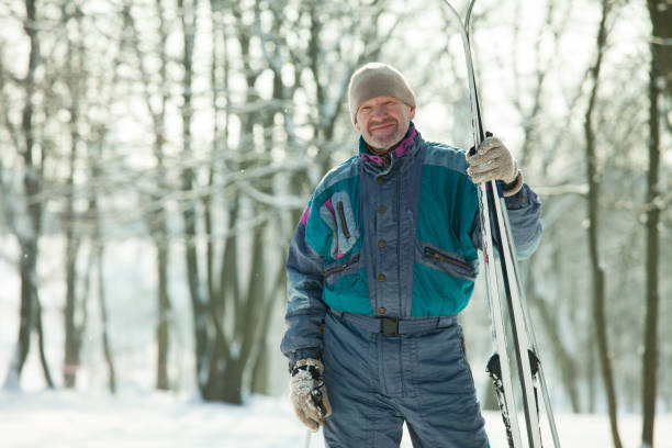 istock Mature man on a ski trip in the winter forest 918965738