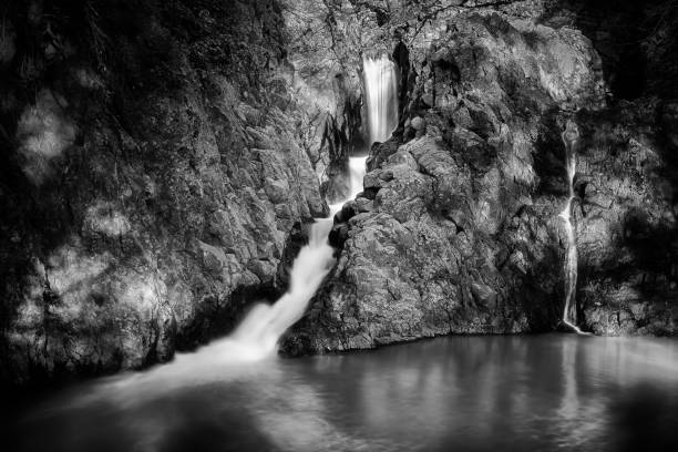 istock Waterfall dell'Arenile, Italy. Waterfall, long exposure. Black and white version. 918969252