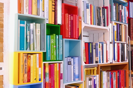 Colorful book shelves packed with books