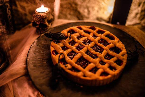 Halloween themed pumpkin pie on Halloween party food table
