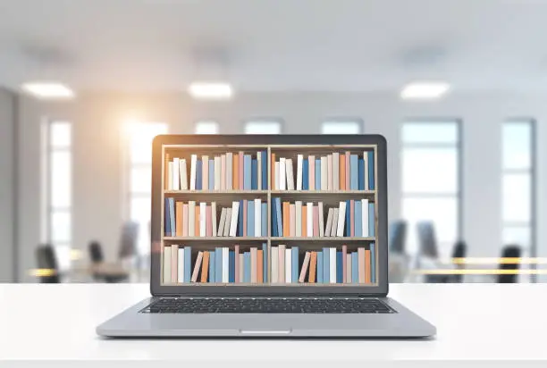 Laptop with bookshelves on its screen is standing on a white desk. A blurred office background. 3d rendering mock up toned image