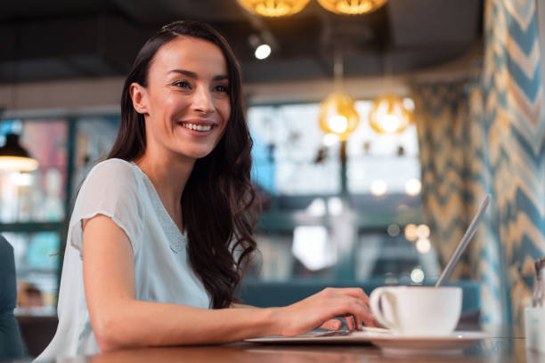 istock Cheerful female freelancer performing project 918975634