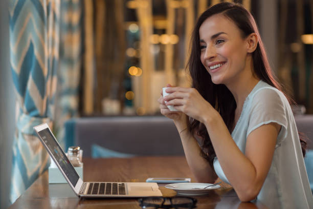 istock Appealing female freelancer working outside office 918977864