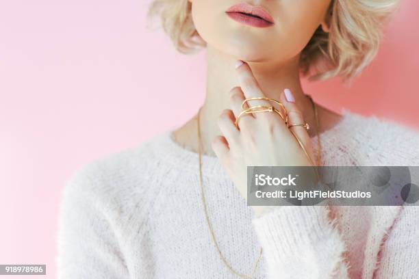 Cropped Shot Of Sensual Young Woman Holding Jewelry In Hand Isolated On Pink Stock Photo - Download Image Now