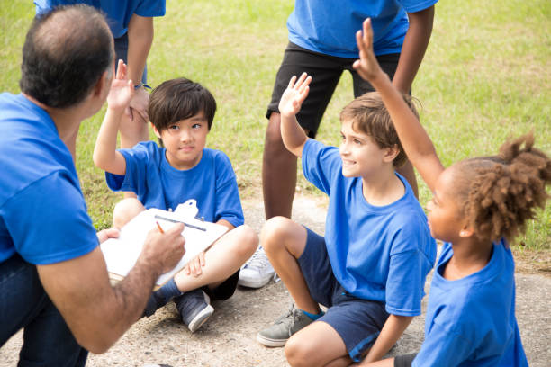 istock Soccer team coach explains next play to his children's team. 918981374