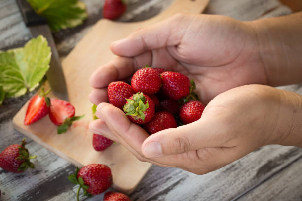 istock Strawberry In a bowl On a Wooden Background 919007060