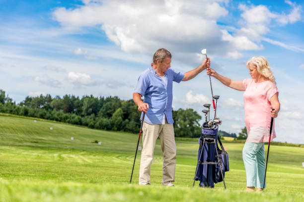 istock Senior couple choosing equipment for a golf game. 919011226