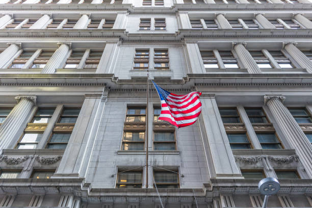 istock American flag with building behind. Perspective view. 919011422