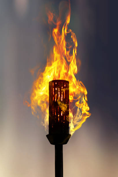 burning torch at night stock photo