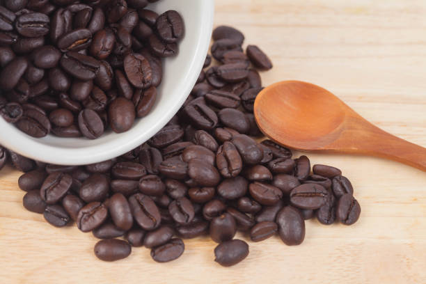 istock coffee beans in white cup on wood table 919017530