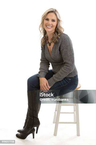 Beautiful Woman Sitting On A Stool Stock Photo - Download Image Now - Women, One Woman Only, Sitting