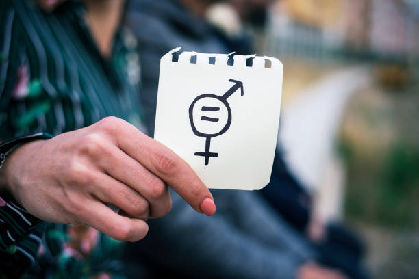 istock woman with a symbol for gender equality 919017892