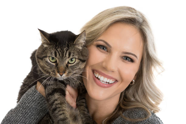 istock Woman Smiling with Tabby Cat 919045190