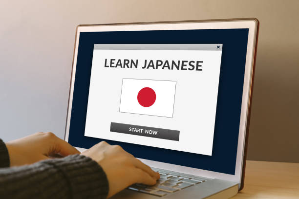 istock Learn Japanese concept on laptop computer screen on wooden table 919151260