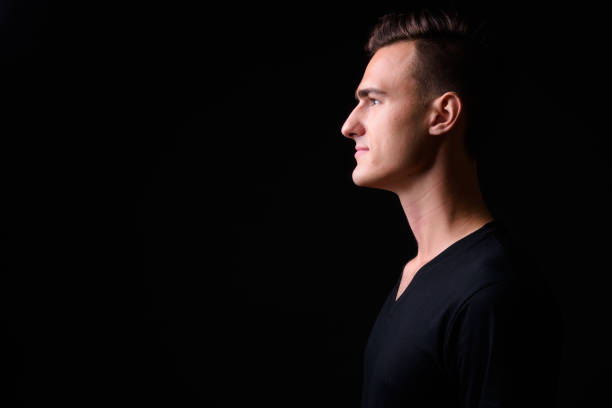 istock Portrait Of Handsome Man Against Black Background 919176068