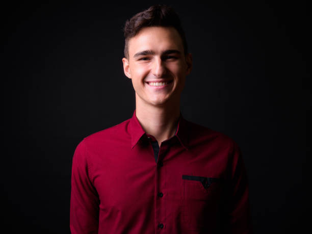 istock Portrait Of Handsome Man Against Black Background 919176314