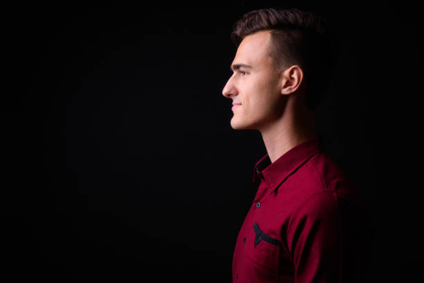 istock Portrait Of Handsome Man Against Black Background 919176390