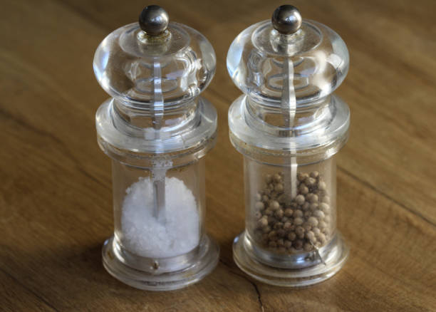istock glass salt and pepper mill set on wooden background 919183840