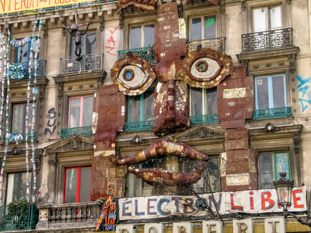 Lights on in the windows of a traditional Parisienne apartment building