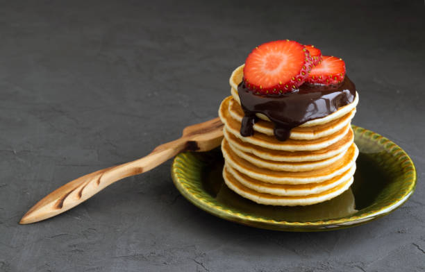 istock Pancakes with chocolate on a gray background. 919184006