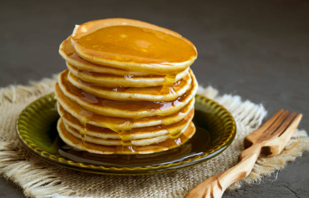 istock Pancakes with honey on a gray background. 919192606