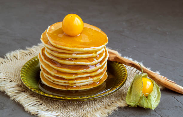 istock Pancakes with ground-cherry on gray background. 919194674