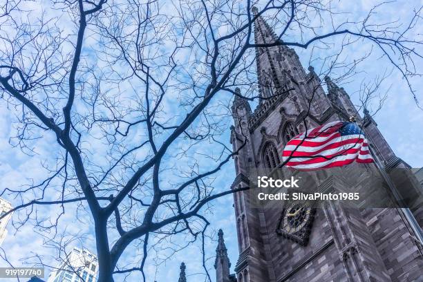 American Flag With Buildings Behind Stock Photo - Download Image Now - American Flag, Business, Capital - Architectural Feature