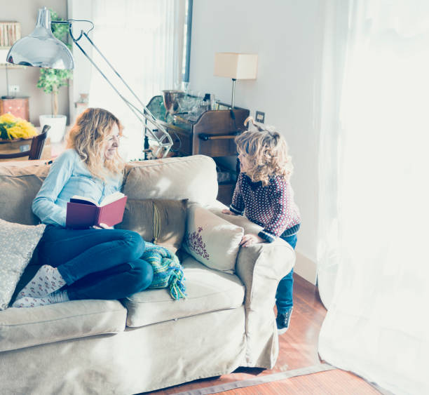 istock Mother with her child at home 919198754