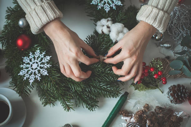 istock Christmas Background with Female Hands and Christmas Decorations 919212676