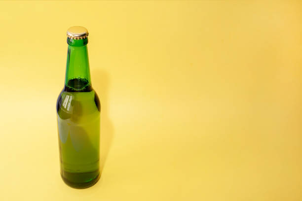 istock A bottle of beer on a yellow background 919219452