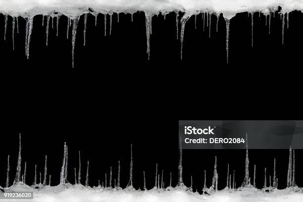 Icicles On A Black Background Space For Text Template For Design Stock Photo - Download Image Now