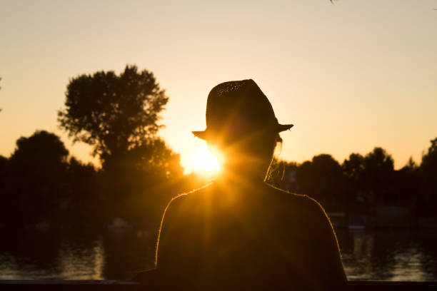 istock The girl speaking on phone and watching sunset 919238148