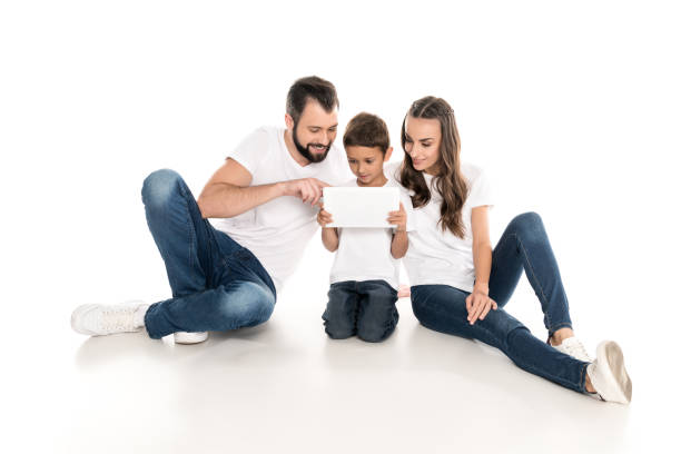 istock family with digital tablet 919242300