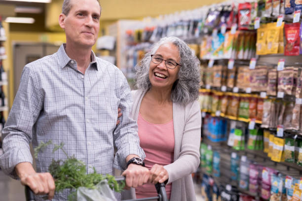 istock Senior Couple Grocery Shopping Together 919252720