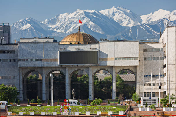 Bishkek, Kyrgyzstan Bishkek, Kyrgyzstan - May 27, 2017: View over the city centre of Bishkek with snow capped mountains in the background. bishkek photos stock pictures, royalty-free photos & images