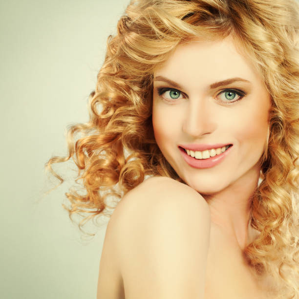 istock Blond Woman with Curly Coloring hair 919297426