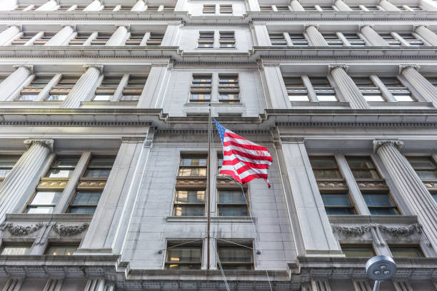 istock American flag with building behind. Perspective view. 919303394