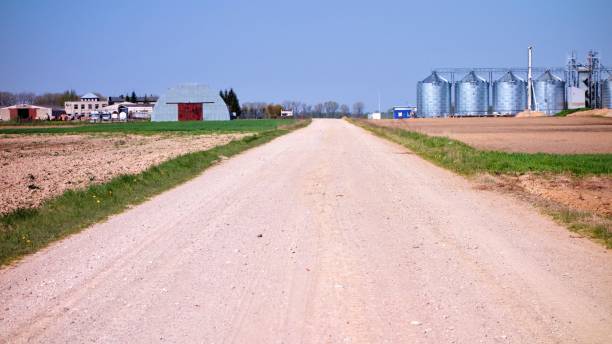 istock gravel path with silos at the background in Lithuania 919303628