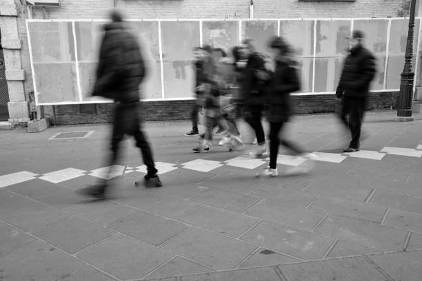 istock blurry people walking in the city center 919306480
