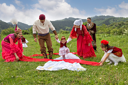 Almaty, Kazakhstan - May 31, 2017: Kazakh people show local tradition of Tusau Kesu which symbolizes a ceremony that accompanies first steps of a child, in Almaty, Kazakhstan.