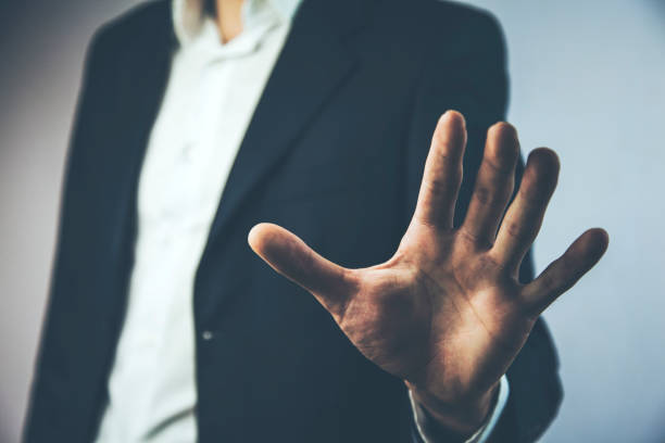 istock Stop hand sign showing by young man 919309818