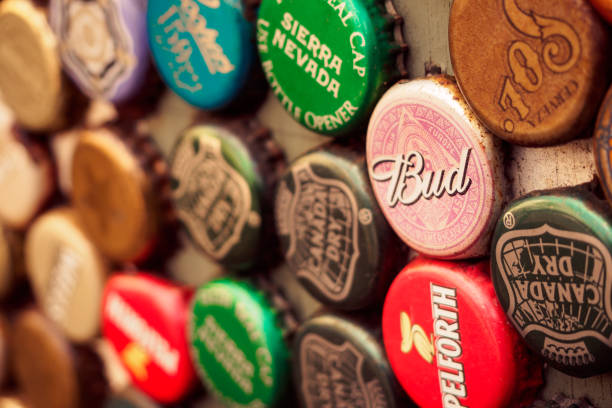 Vintage bottle caps on a wall in a pub. Landscape format.