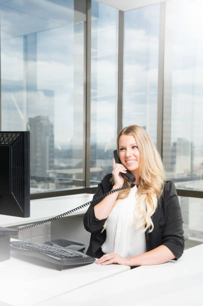 istock Business Women At Her Desk 919318026