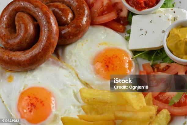 Breakfast With Eggs Sausage And French Fries Stock Photo - Download Image Now - 2018, 2019, Animal Blood